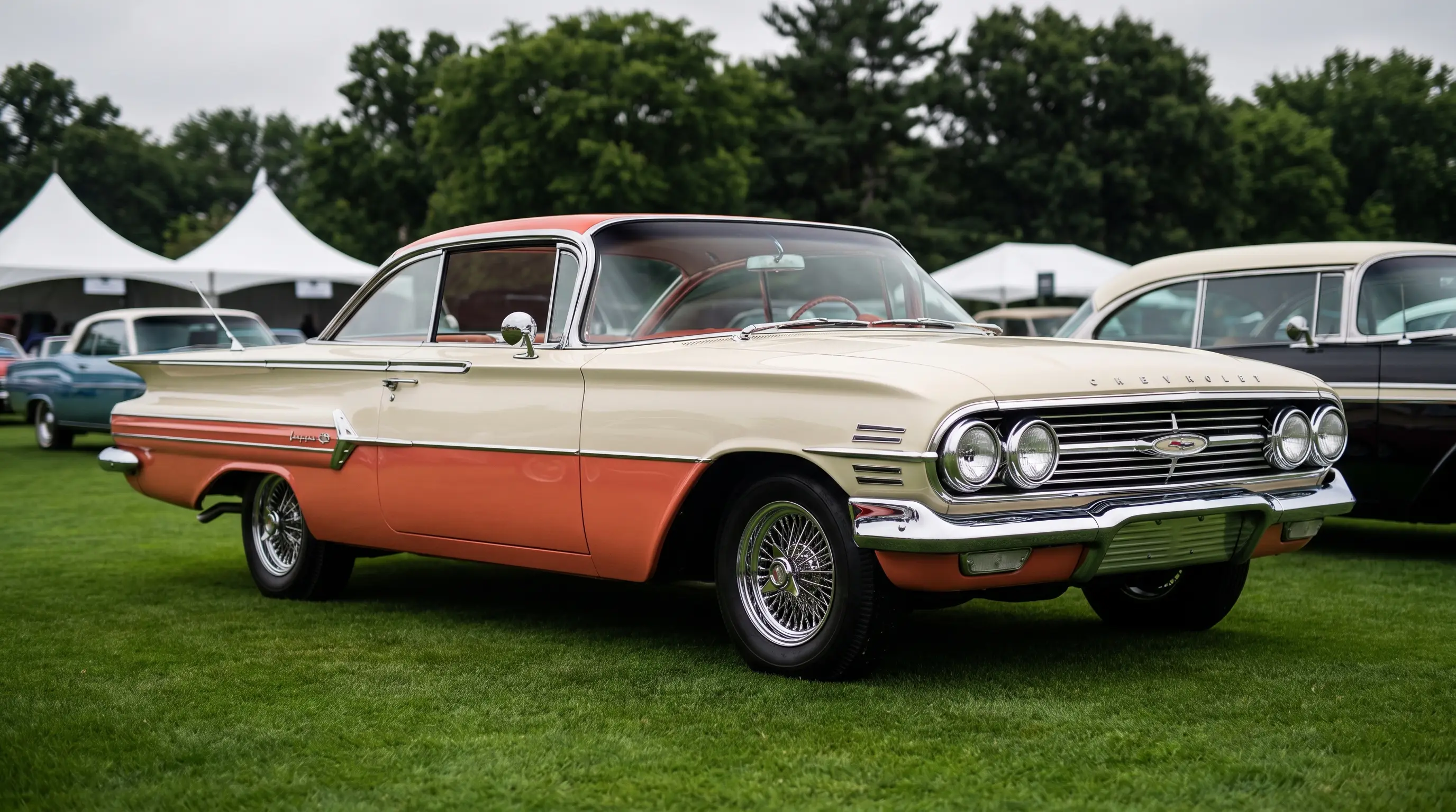 1960 Chevrolet Impala in cream and coral at a classic car concours show