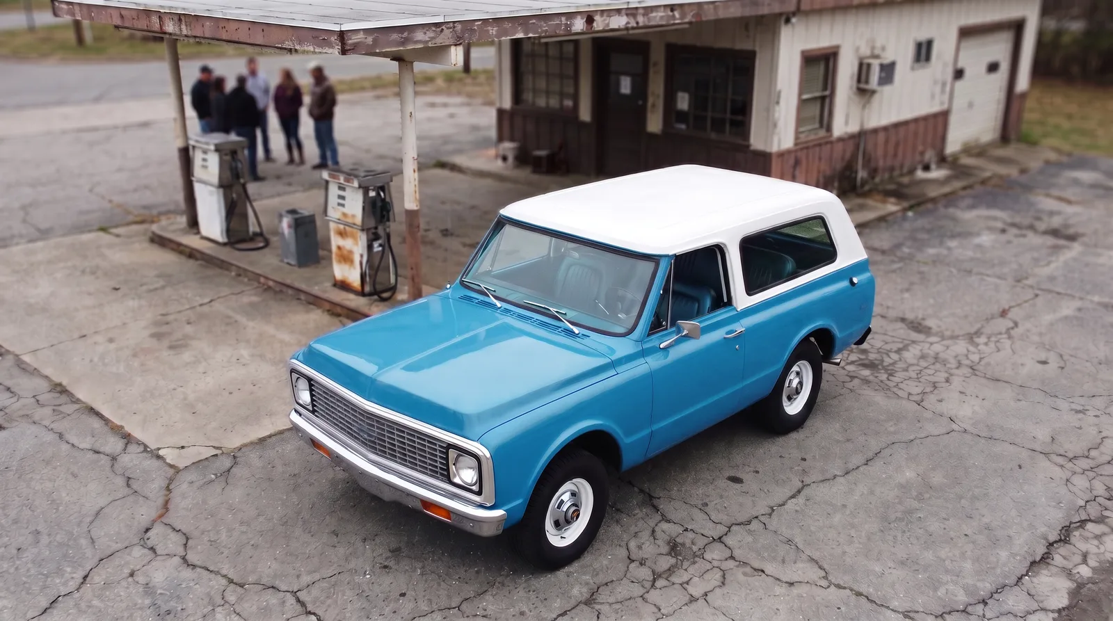 1972 Chevrolet K5 Blazer, blue with white top at an old gas station
