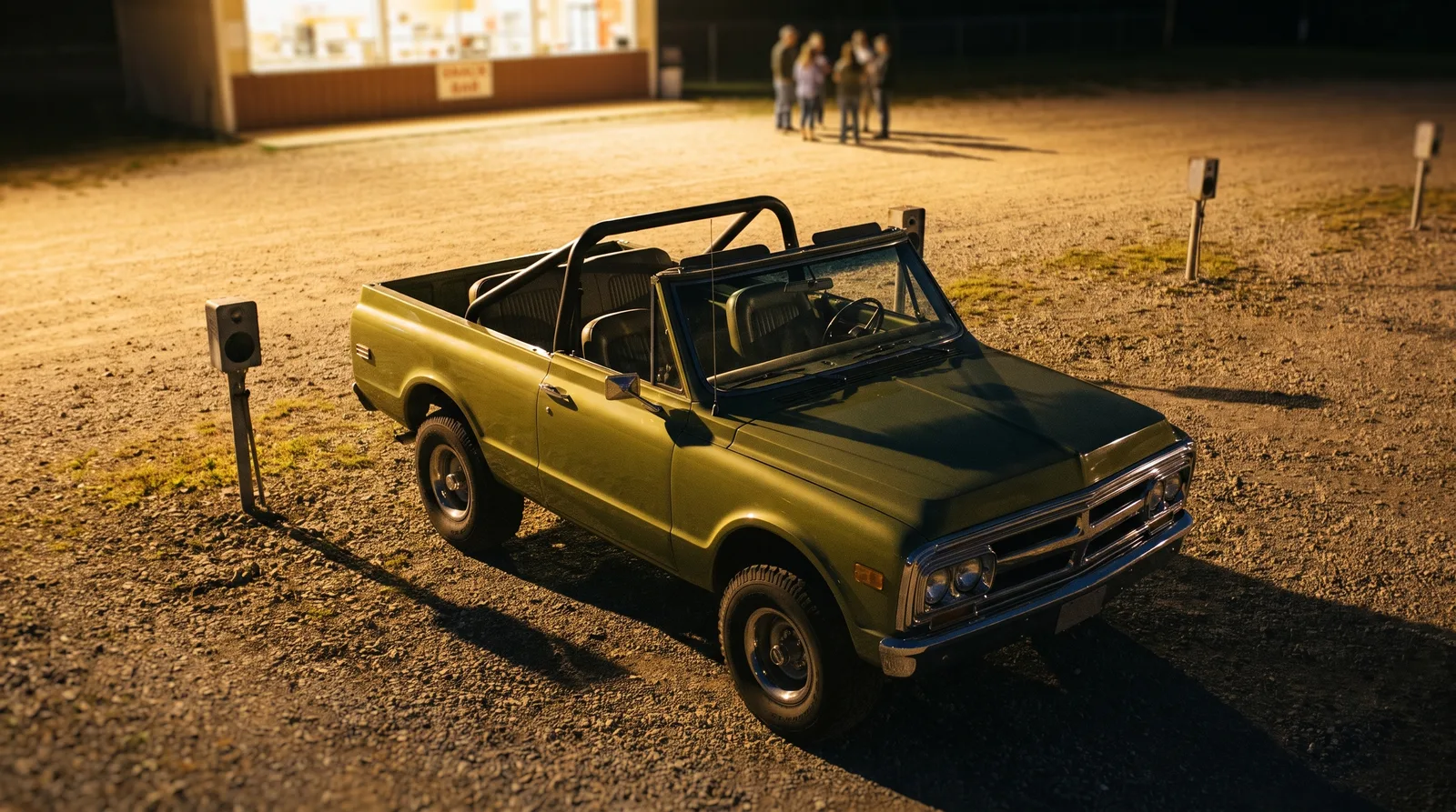 1970 GMC Jimmy — top off at a drive-in theatre at night