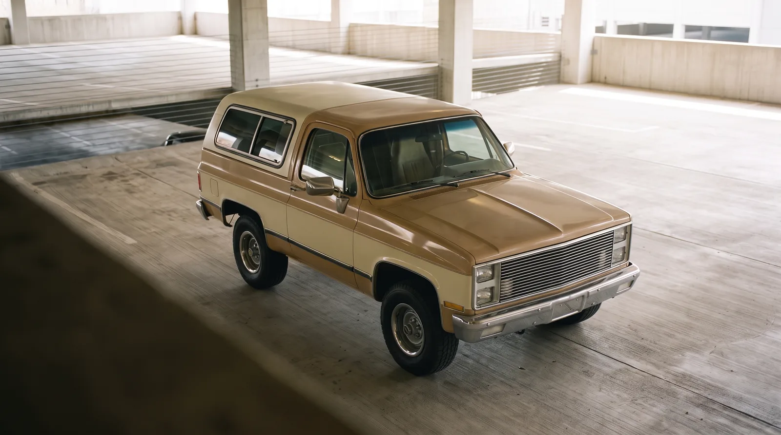 1984 GMC Jimmy Sierra, two-tone truck in a parking garage