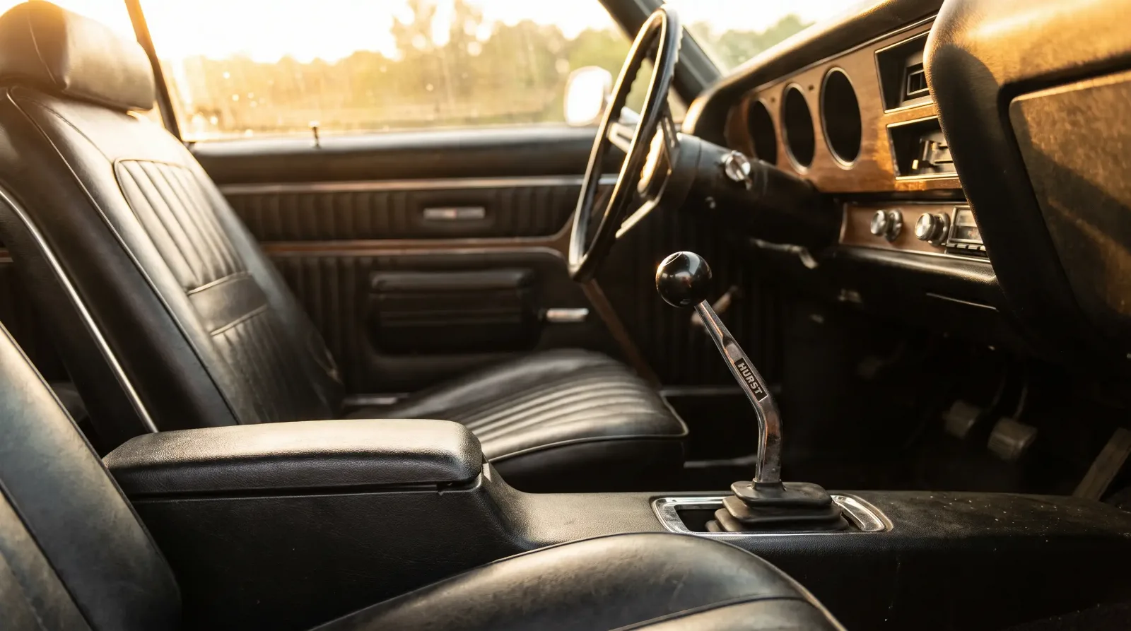 Chrome Hurst four-speed shifter on the console of a 1970 Pontiac GTO interior
