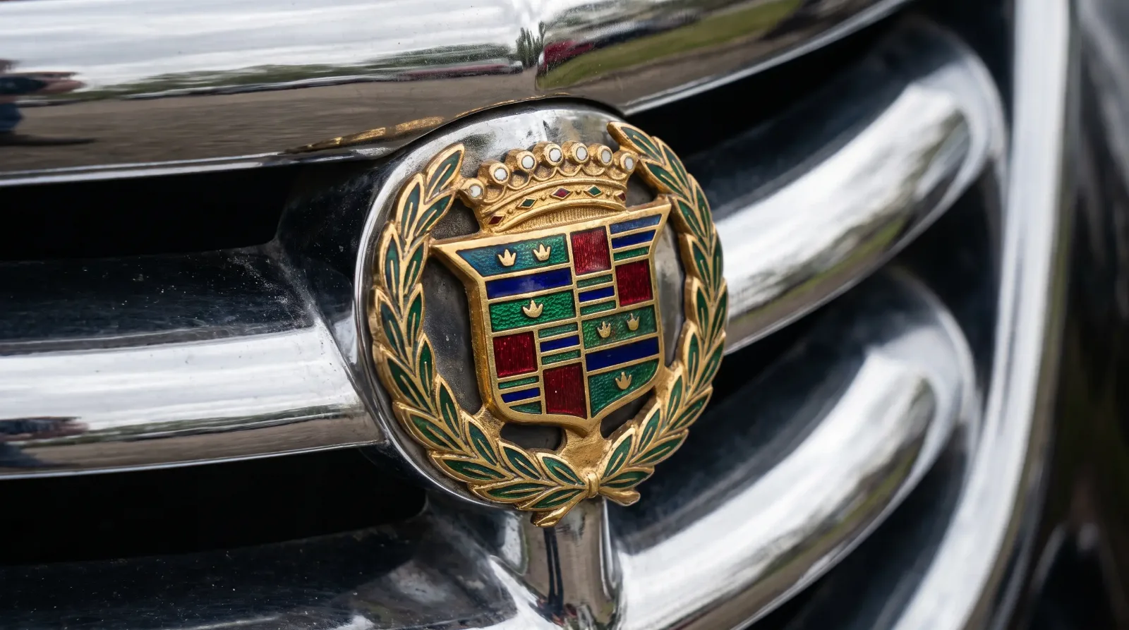 Enamel heraldic crest badge on a chrome grille