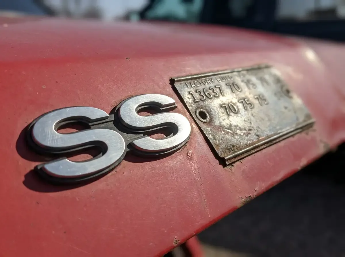 Chevelle SS trunk lid badge and cowl tag detail close-up