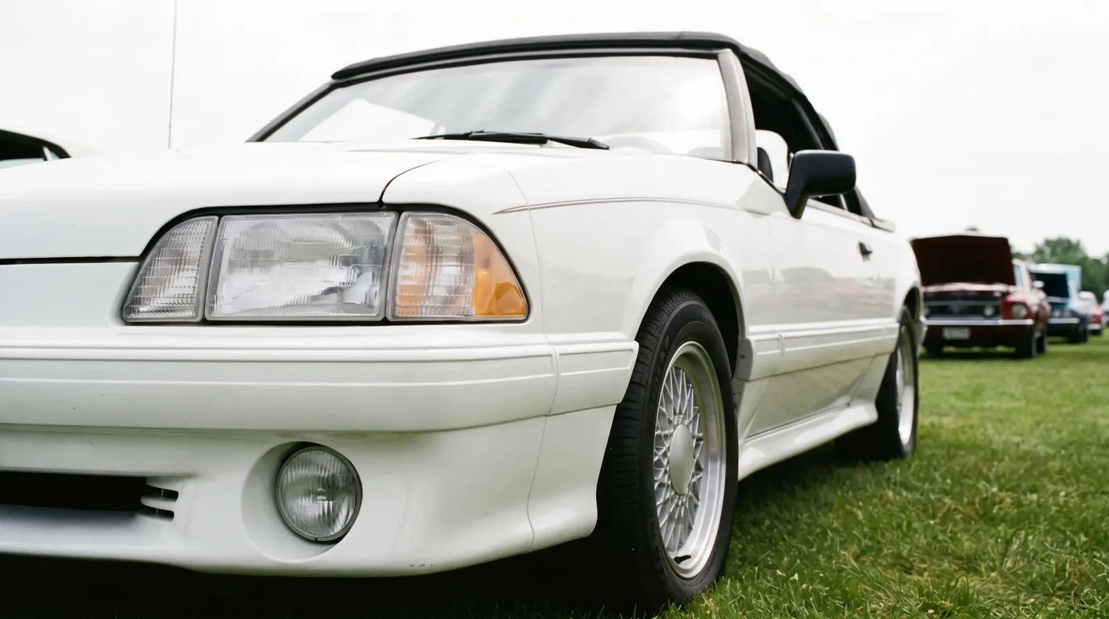 1988 ASC McLaren Mustang convertible, front corner at a car show