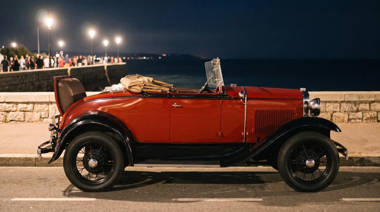 1931 Ford Model A Roadster, rumble seat open by the sea at night