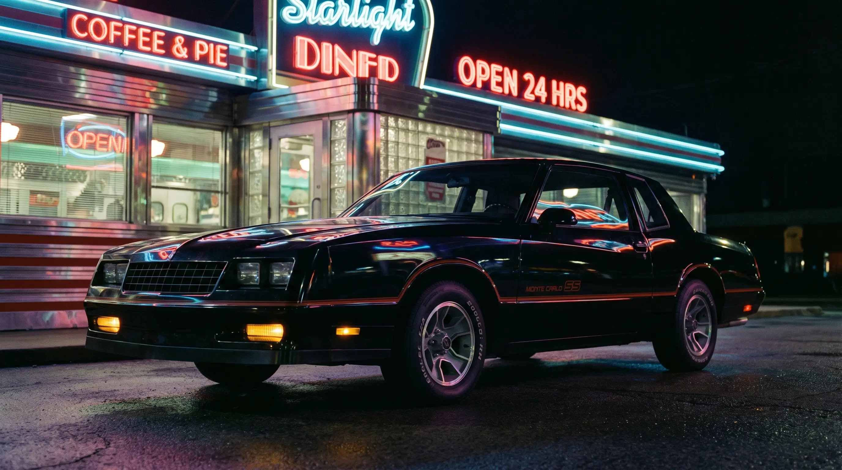 1986 Chevrolet Monte Carlo SS under neon signage outside a retro diner at night