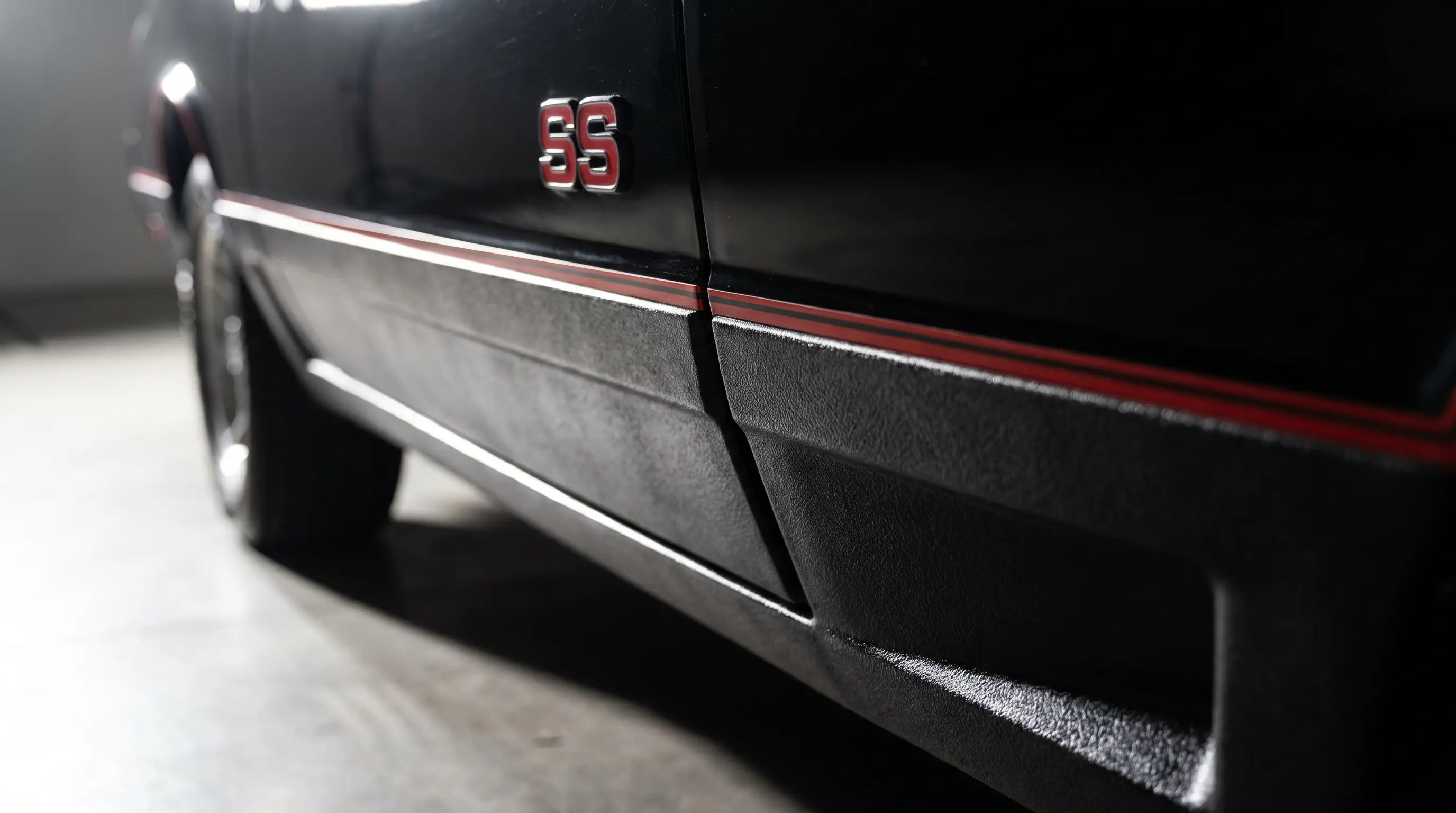 Close up of black Monte Carlo SS ground effects cladding and SS badge