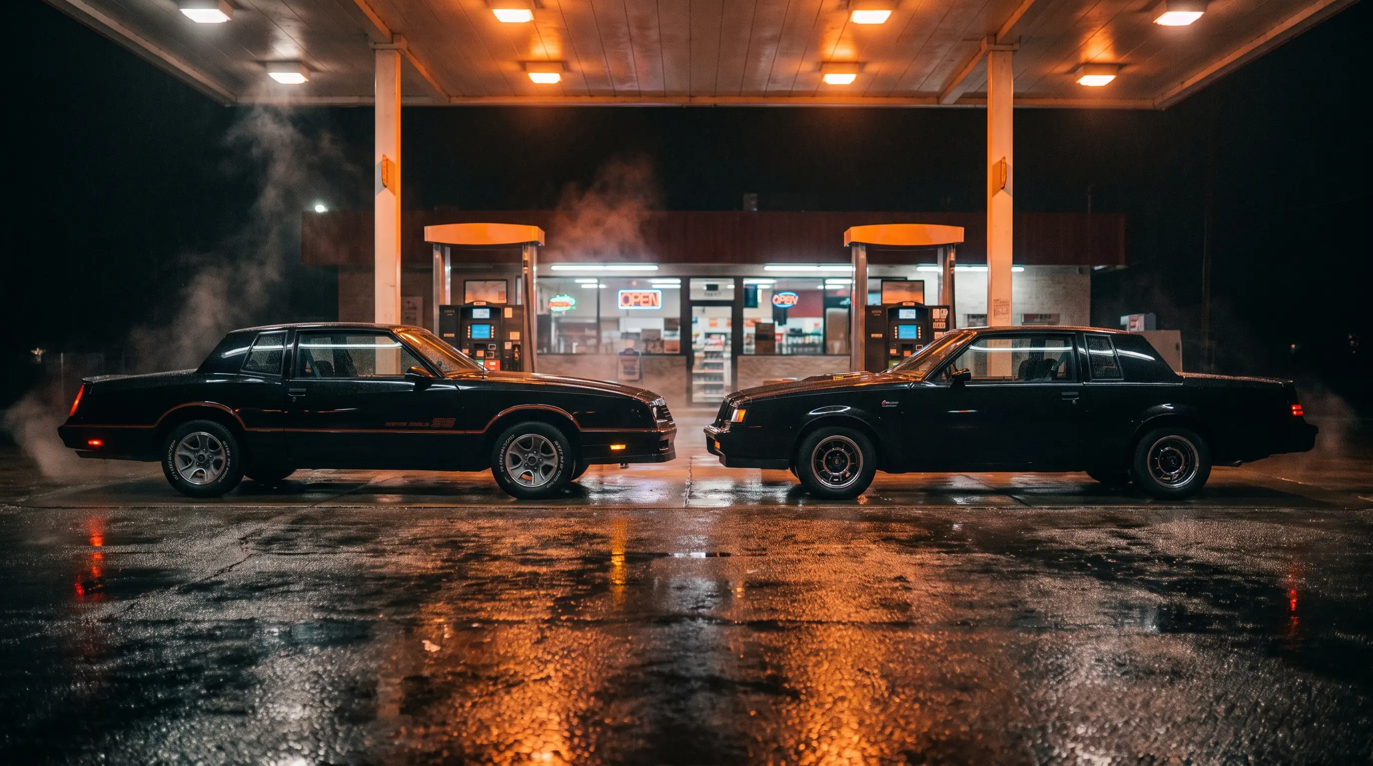 Black Monte Carlo SS and black Buick Grand National at a night gas station