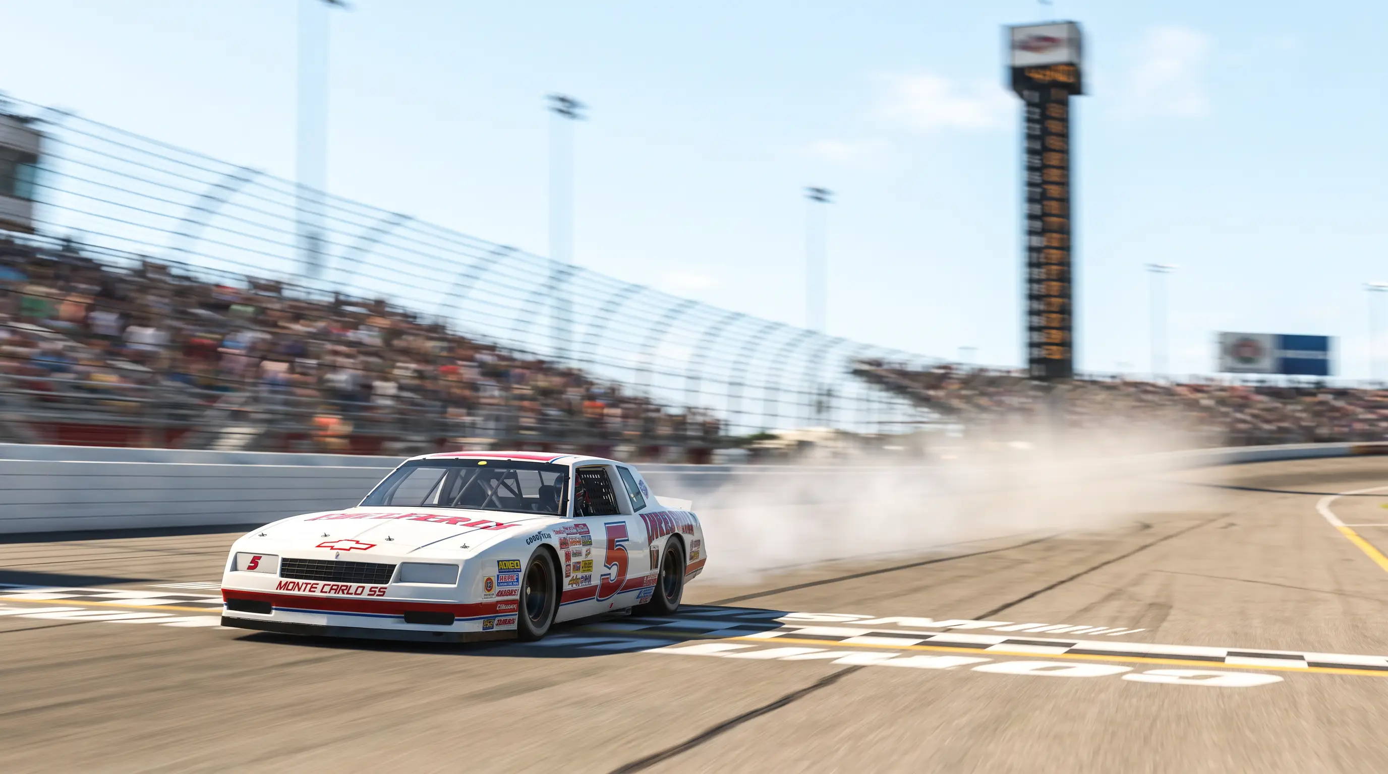 White number 5 Monte Carlo SS stock car crossing the finish line at Daytona