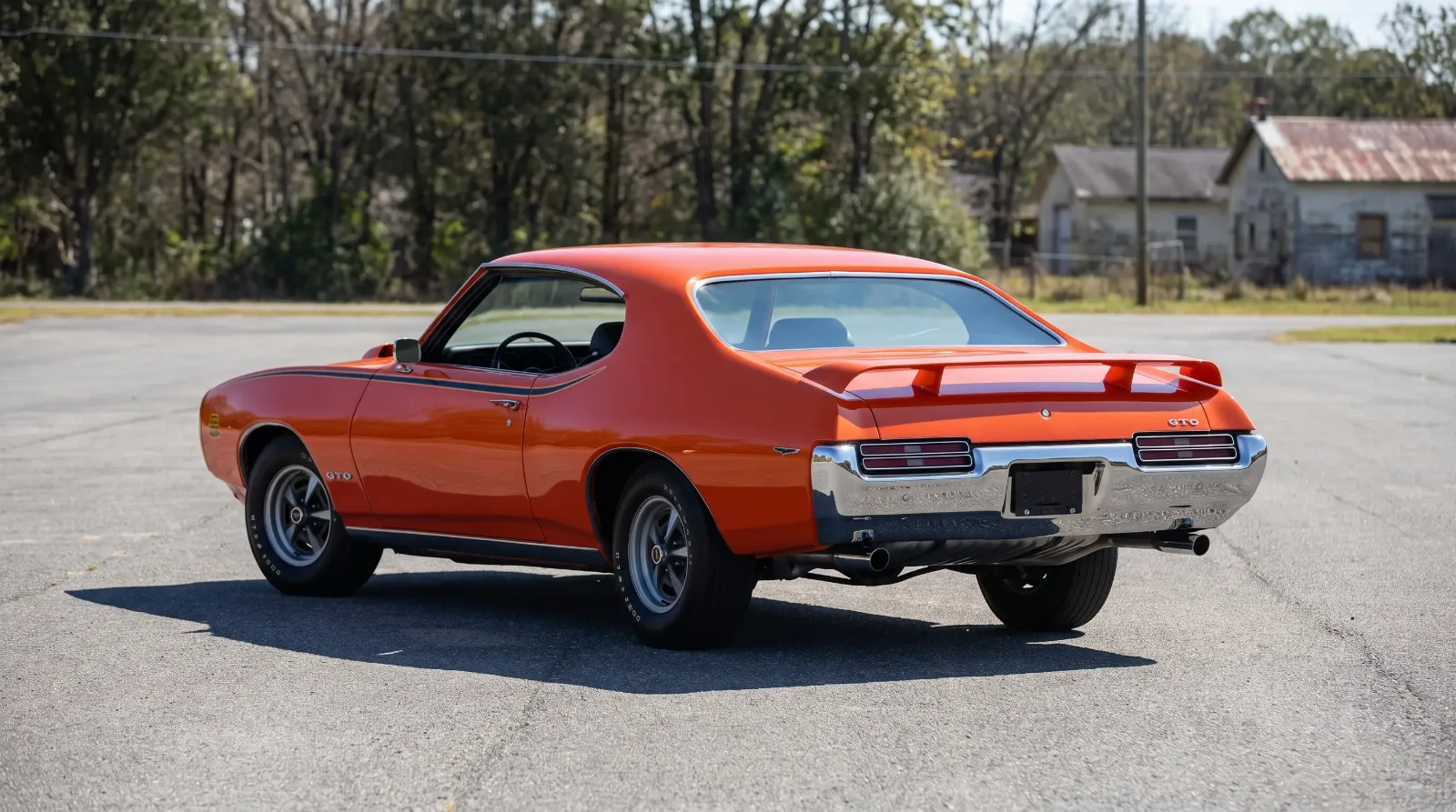 1969 Pontiac GTO Judge in orange with rear spoiler, rear three-quarter view