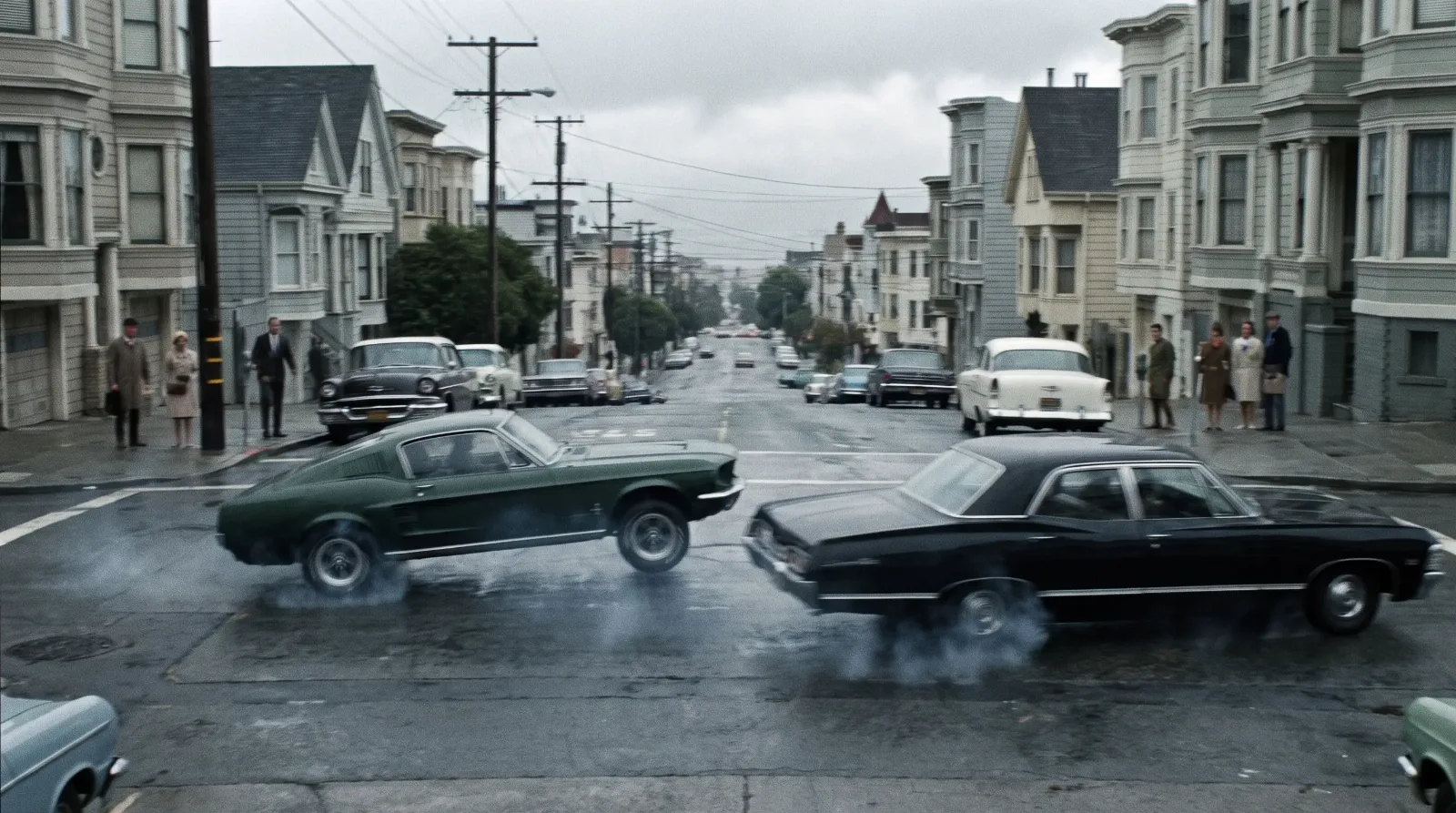 Highland Green fastback muscle car airborne chasing a black coupe on a San Francisco hill