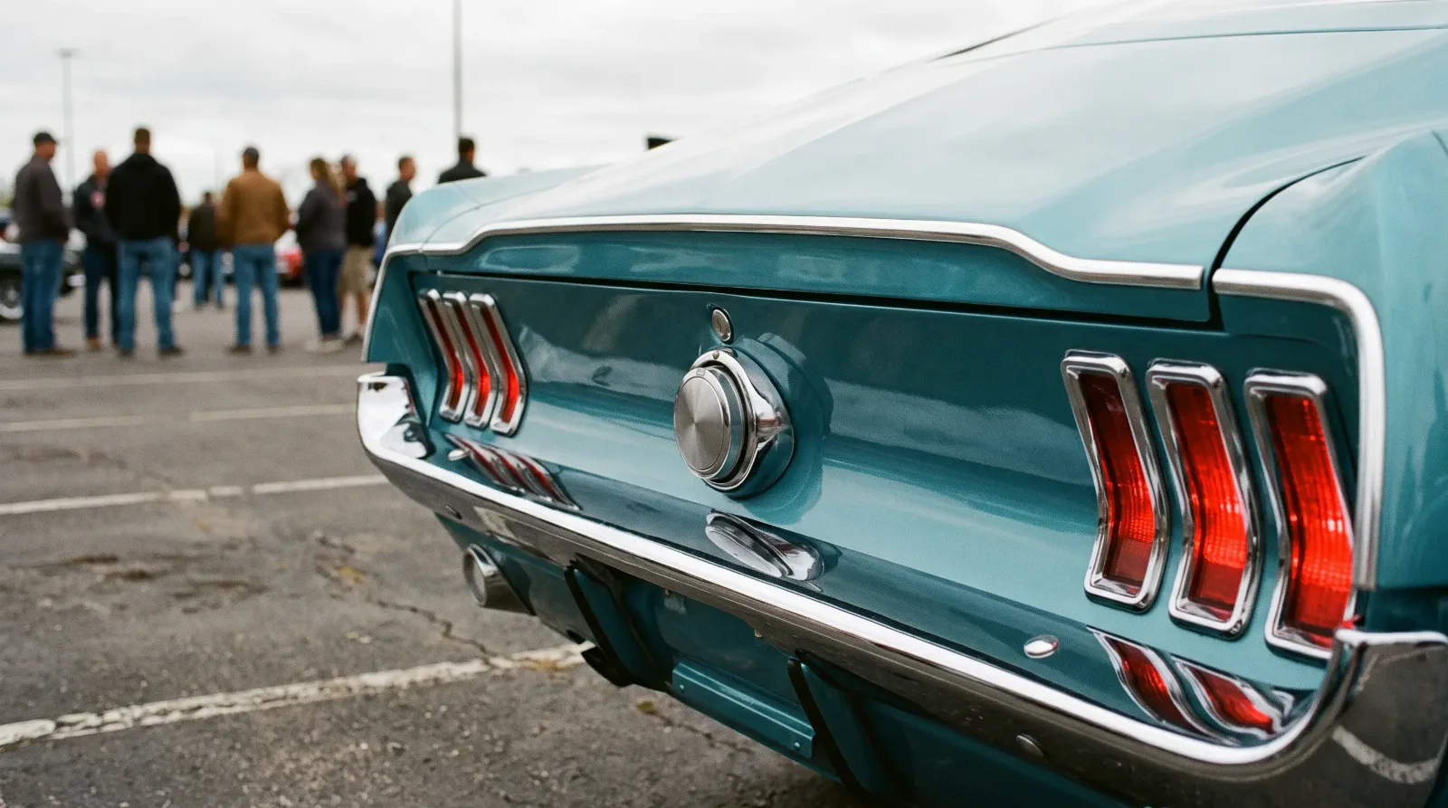 1967 Ford Mustang fastback, tri-bar taillights in a parking lot