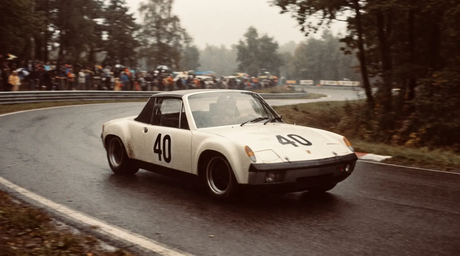 Porsche 914/6 GT race car cornering hard on a European circuit in period 1970 livery