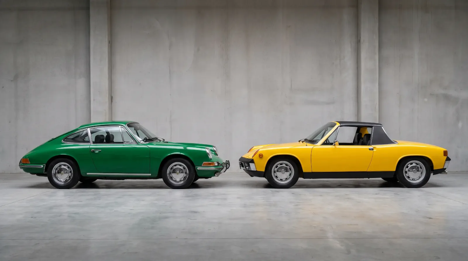 Porsche 912 in Irish Green parked beside a Porsche 914 in Signal Yellow in a showroom, side by side comparison