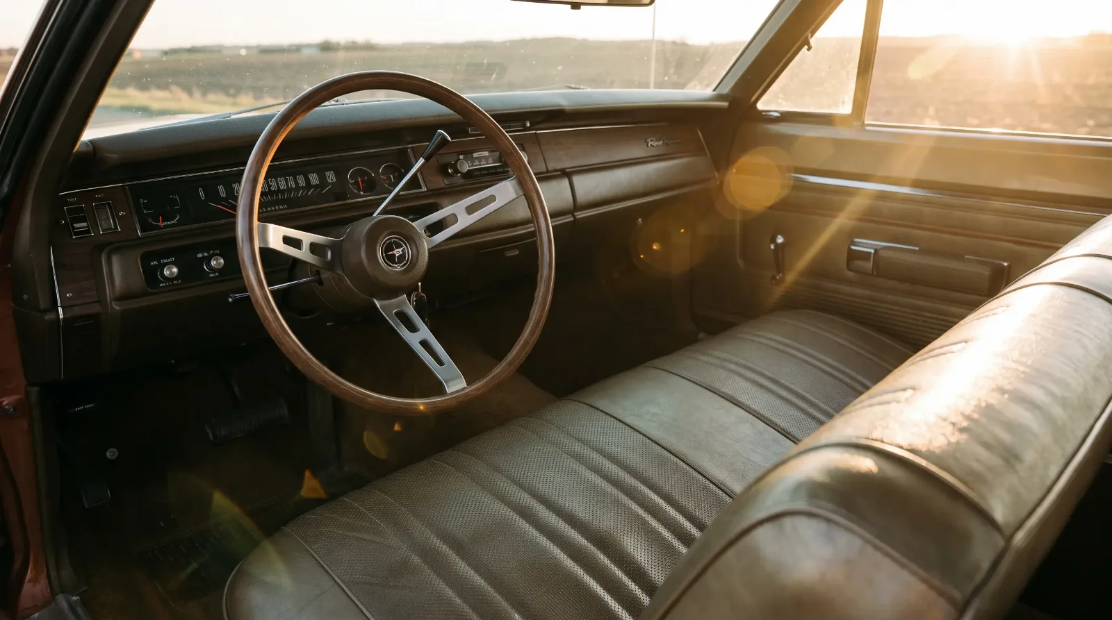 Interior dashboard and bench seat of a 1969 Plymouth Road Runner