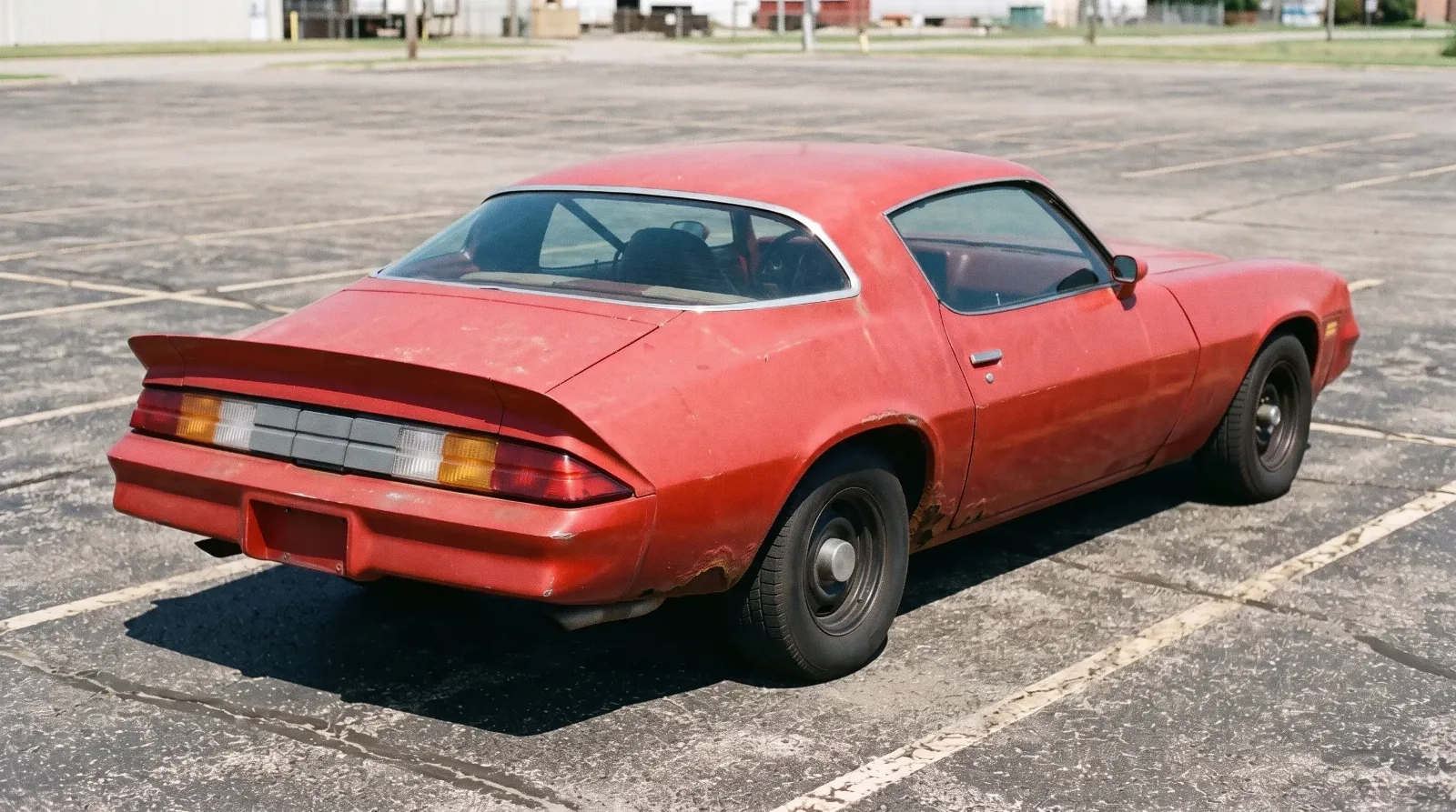1979 Chevrolet Camaro Z28, rust bubbling behind the rear wheel