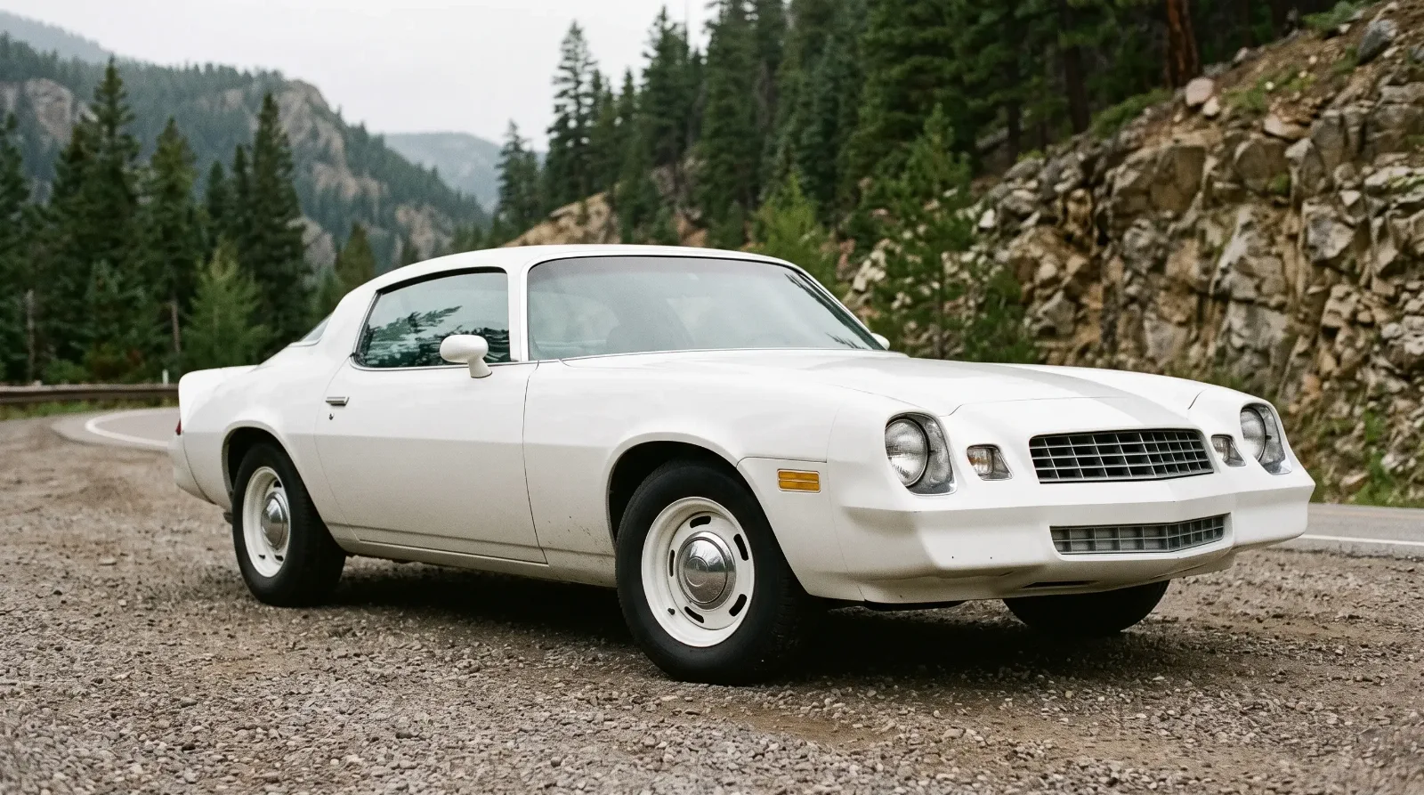 1978 Chevrolet Camaro, parked on a mountain pass shoulder