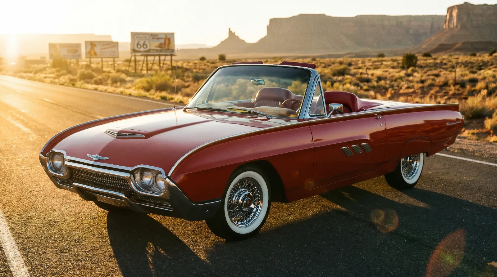 Classic 1960s Ford Thunderbird convertible on an American road at golden hour