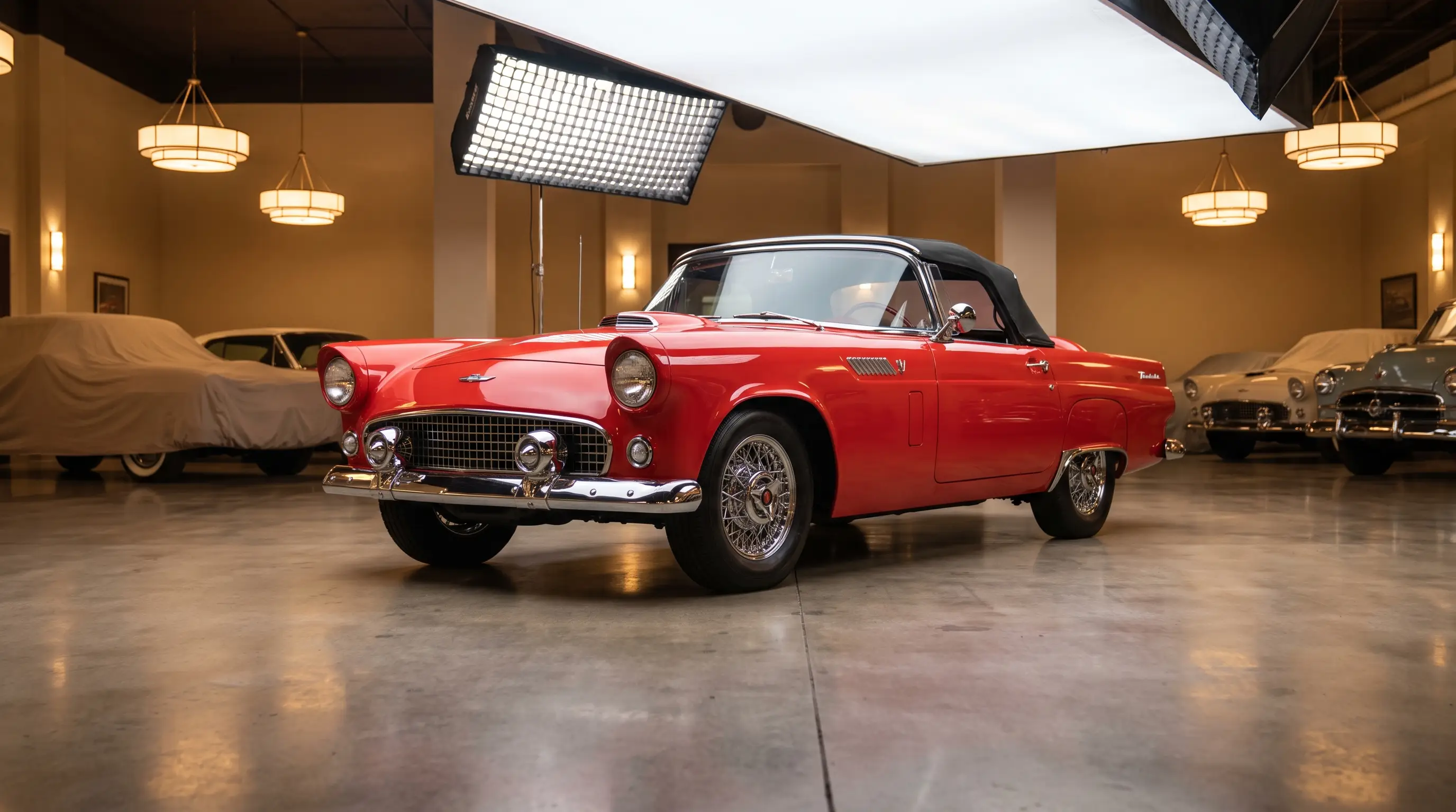 1955 Ford Thunderbird two seat convertible gleaming in a classic car showroom