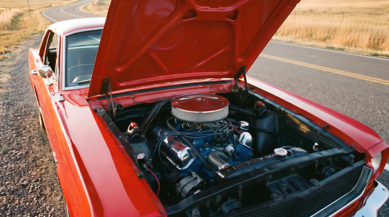 1965 Ford Mustang 289 Hi-Po, hood up on a country road