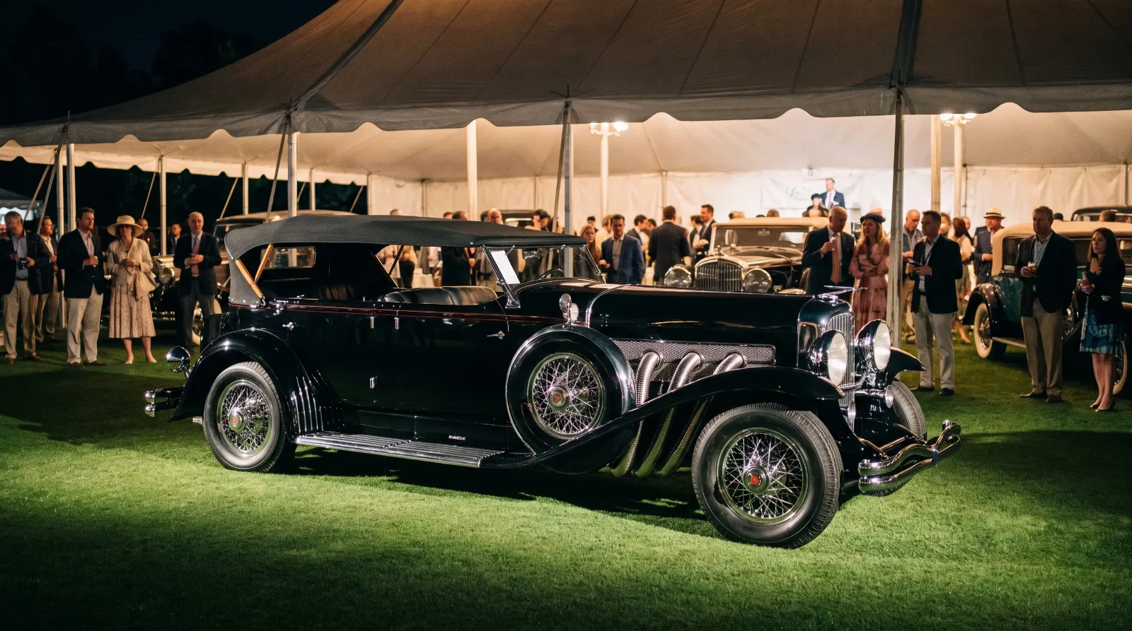 Supercharged Duesenberg spotlit at a concours auction