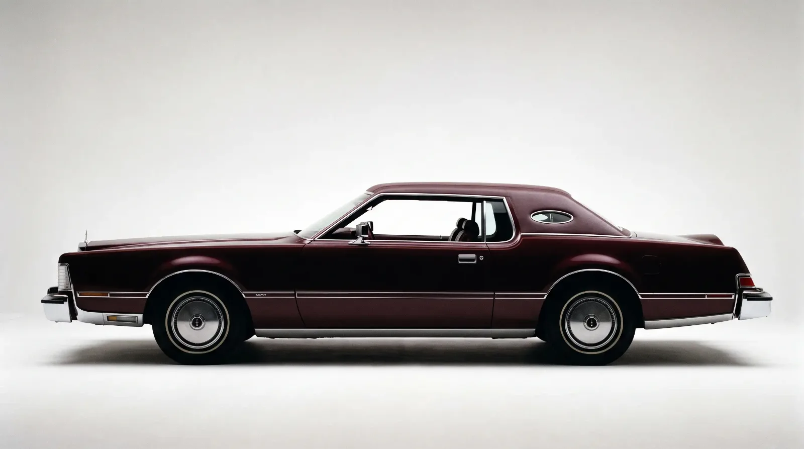 Side profile of a personal luxury coupe long hood short deck