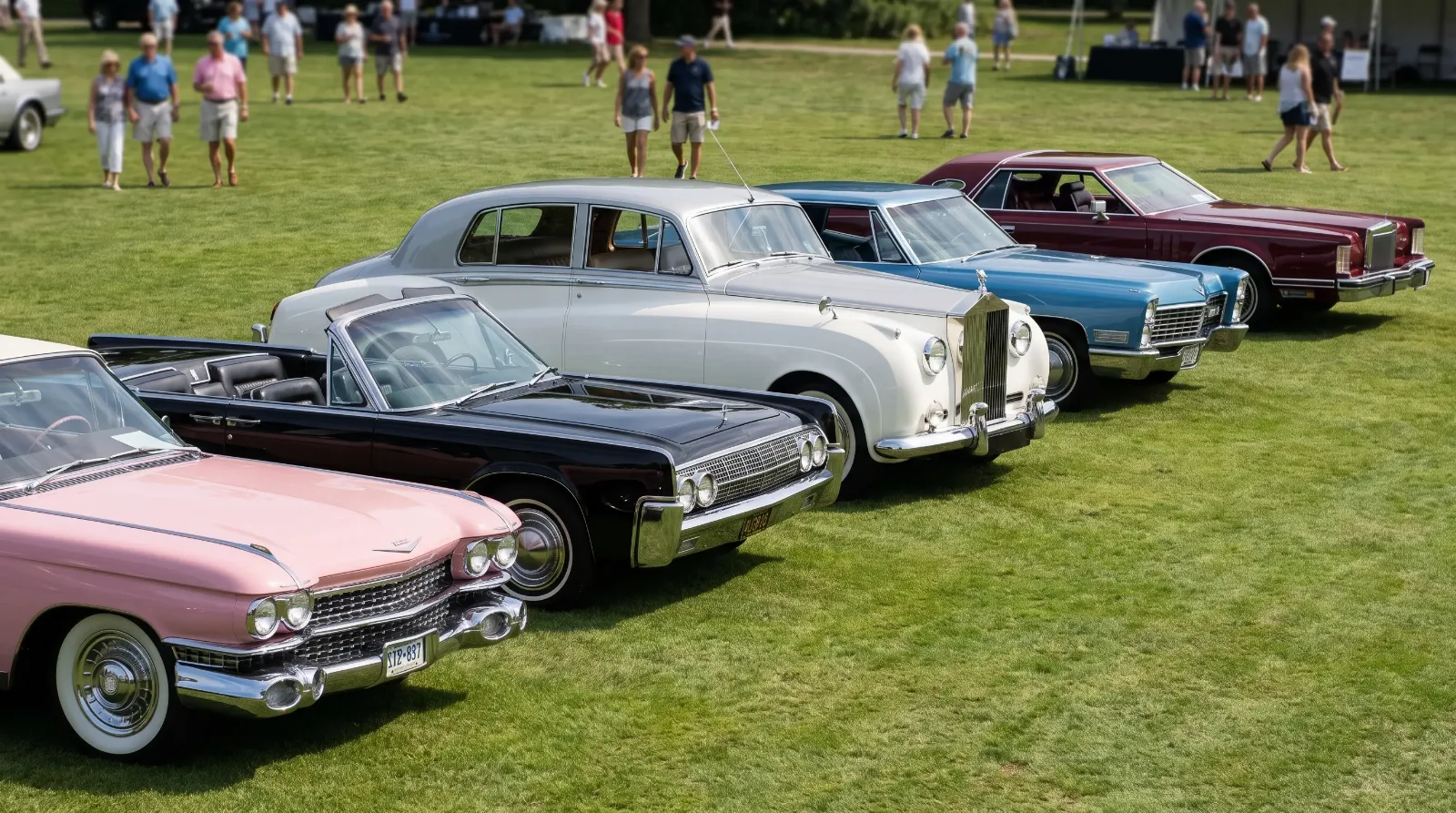 A row of classic American luxury cars from the 1950s to 1970s lined up on a show field, spanning the price tiers of the collector market