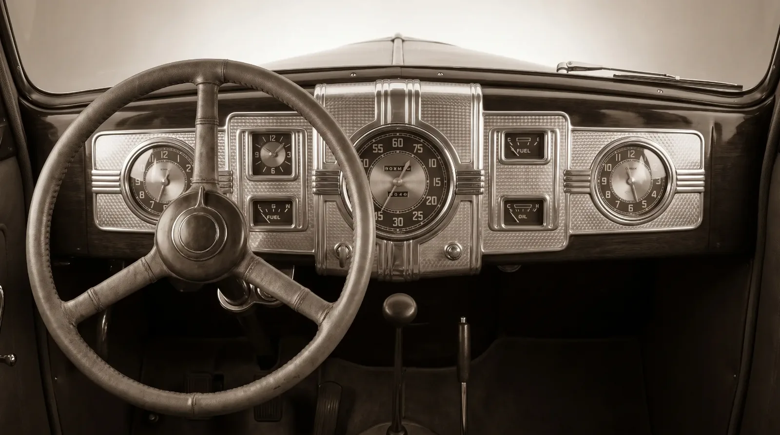 Stepped Art Deco dashboard with geometric gauge cluster