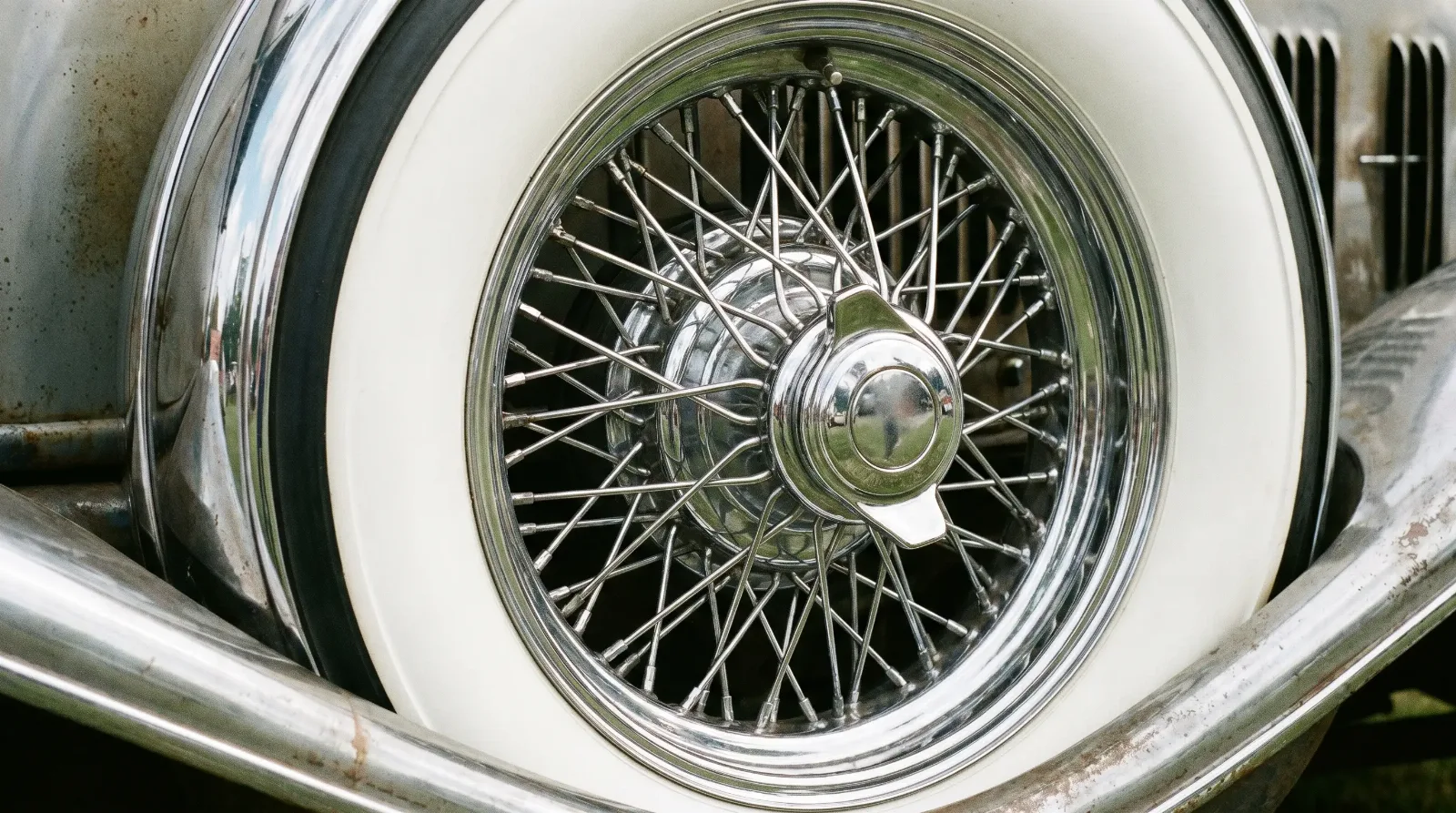 Genuine chrome wire spoke wheel with wide whitewall tire