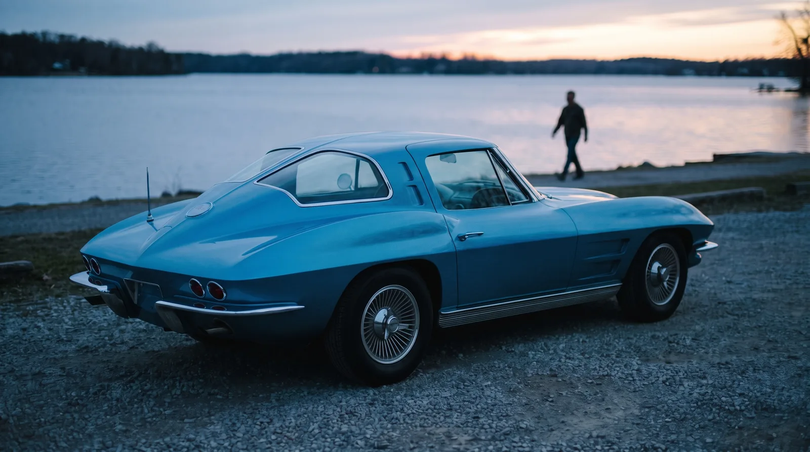 1963 Chevrolet Corvette Sting Ray split-window coupe, lakeside gravel lot at dusk
