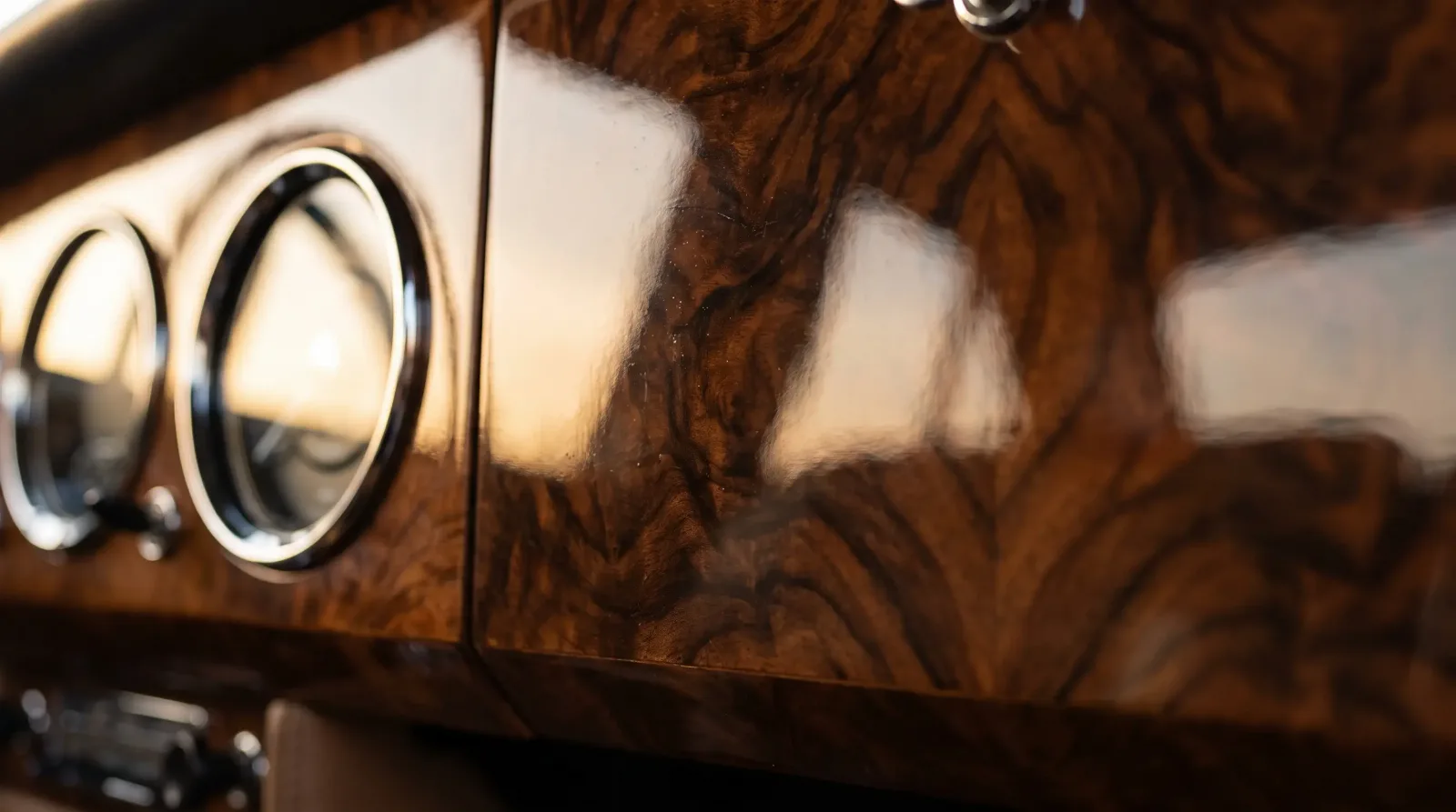 Book-matched burr walnut dashboard fascia with deep lacquer in a 1960s Bentley